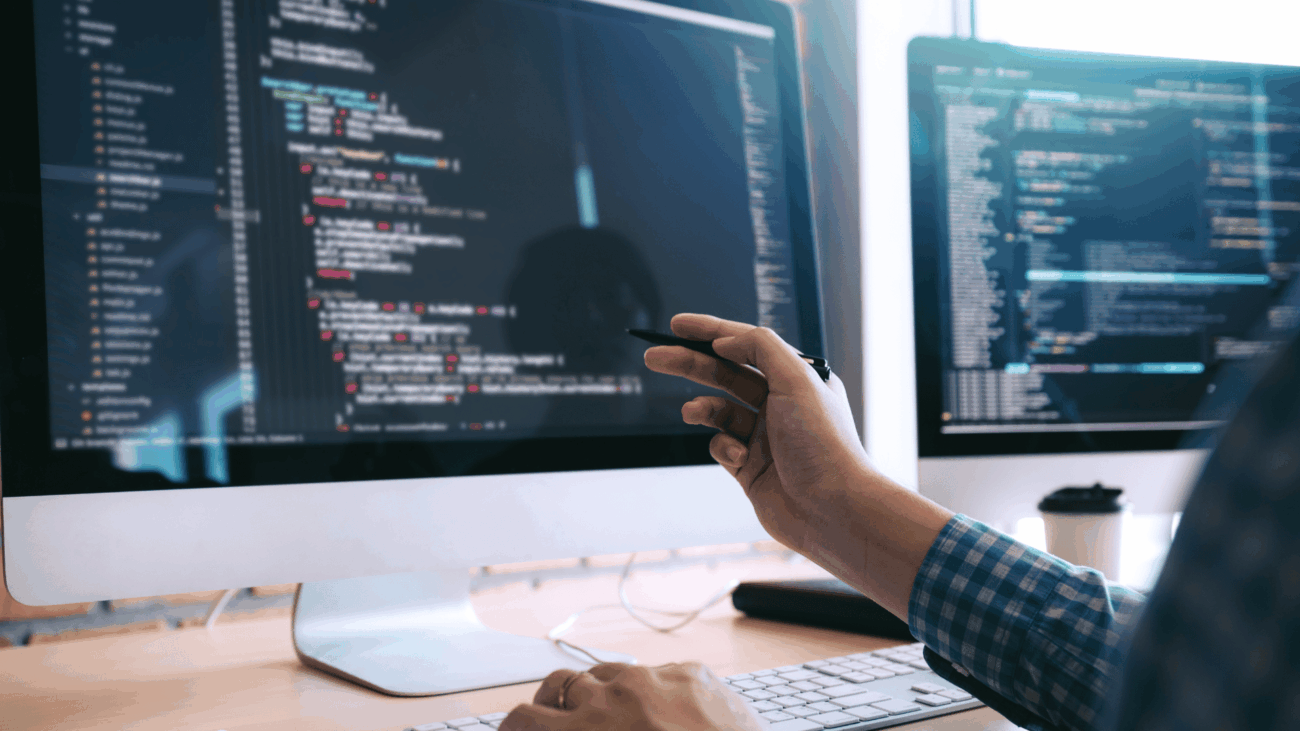 Computer screen with hand pointing at it - cisco Meraki